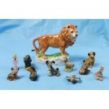 Ornamental pottery Lion and a group of miniature animal figures (some Wade)