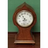 Balloon shaped Mantel Clock, with a platform escapement, in a boxwood inlaid case, on 4 brass