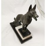 Bronzed spelter figure of a German Shepherd Dog, on a stepped black and beige marble base, 27cm w