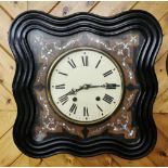 French Vineyard Wall Clock, with a shell appliqué inlay on a serpentine shaped and ebonised clock