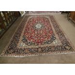 Red Ground Persian Kashan Carpet, with a traditional Kashan Design, 3.13m x 1.94m