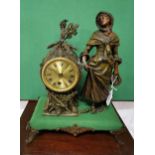 Mantel Clock, featuring Spelter figure of lady wearing a cape, brass dial, raised on cabriole leg