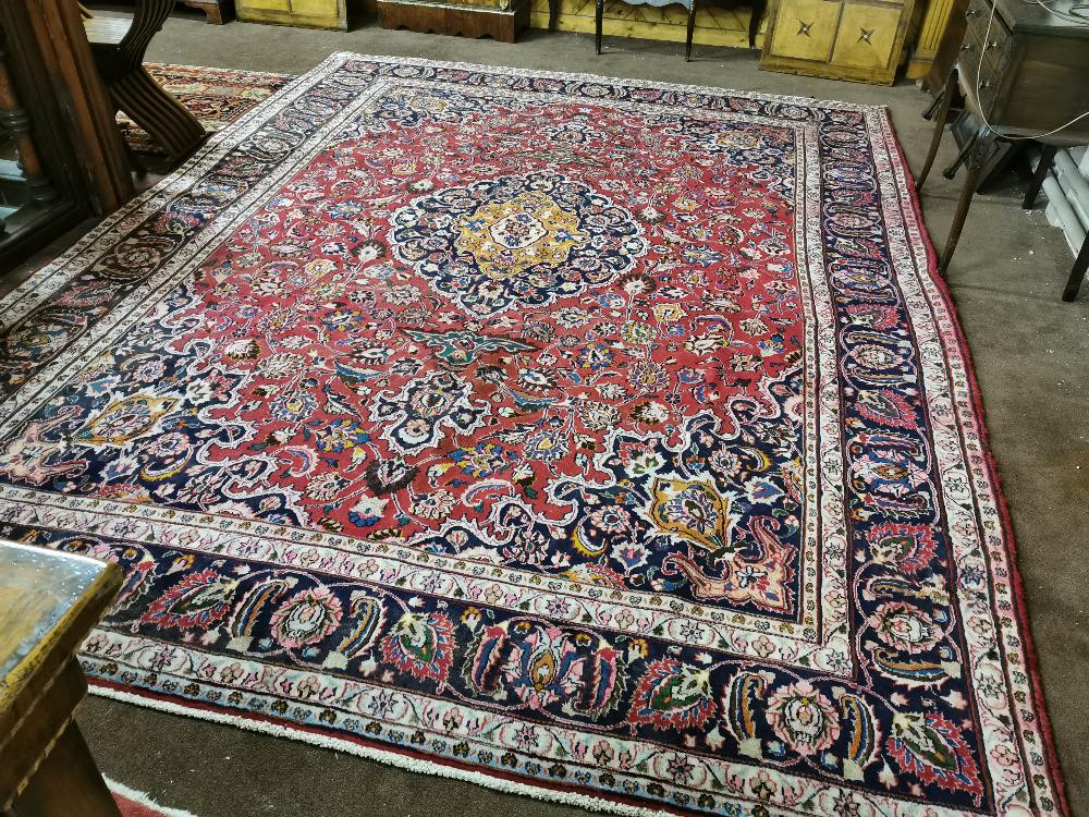 Large red ground Persian Mashad Carpet, floral medallion design, 3.8 x 2.8m