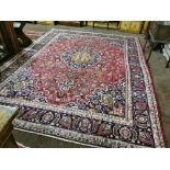 Large red ground Persian Mashad Carpet, floral medallion design, 3.8 x 2.8m