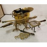 Pair of 19th C brass Fire Dogs & set of 3 brass Irons, brass Coal Helmet and 2 Trivets (8)
