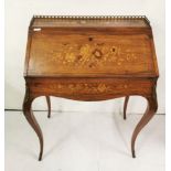 French Kingwood Bureau de Dame, profusely inlaid with floral marquetry designs, with a brass