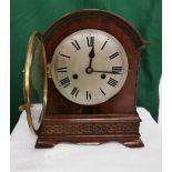 Mahogany Cased Mantel Clock, with a silver dial, chiming movement and a dome shaped top, 29cm x 25cm