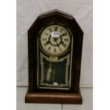 Octagonal topped Mantel Clock in a simulated rosewood case with a painted glass door, visible