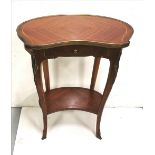 Kidney Shaped 2-Tier Satinwood Table with brass border, over an apron drawer and gilt mounts,