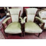 Pair of Late Victorian Walnut Green upholstered Tub shaped Chairs on turned tapering front supports