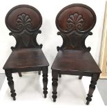 Matching Pair of WMIV Mahogany Hall Chairs, with acanthus and shield decorated backs, on turned