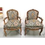 A Matching Pair of French Salon Armchairs, with original various coloured tapestry upholstery, 85cmH