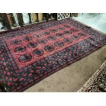 Rich Red Ground Afghan Double Knot Carpet, full pile, with a traditional Bocarra design, 2.85 x 1.