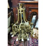 Large ornate Brass Chandelier, with 8 uplighters and 14 downlighters, featuring several mounts of