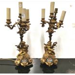 Pair of fine early 19thC Ormolu Candleabra, each with 4 scrolled branches above cherubs carrying