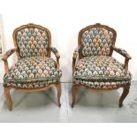 A Matching Pair of French Salon Armchairs, with original various coloured tapestry upholstery, 85cmH