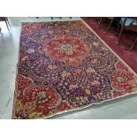 A Persian Wool Floor Rug, purple/blue ground with red ground stylised borders, 2.9 x 1.93m