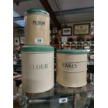 Vintage cake tin and two flour tins.