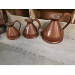 Set of three copper measures.