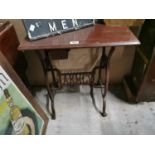 Cast iron sewing machine table.