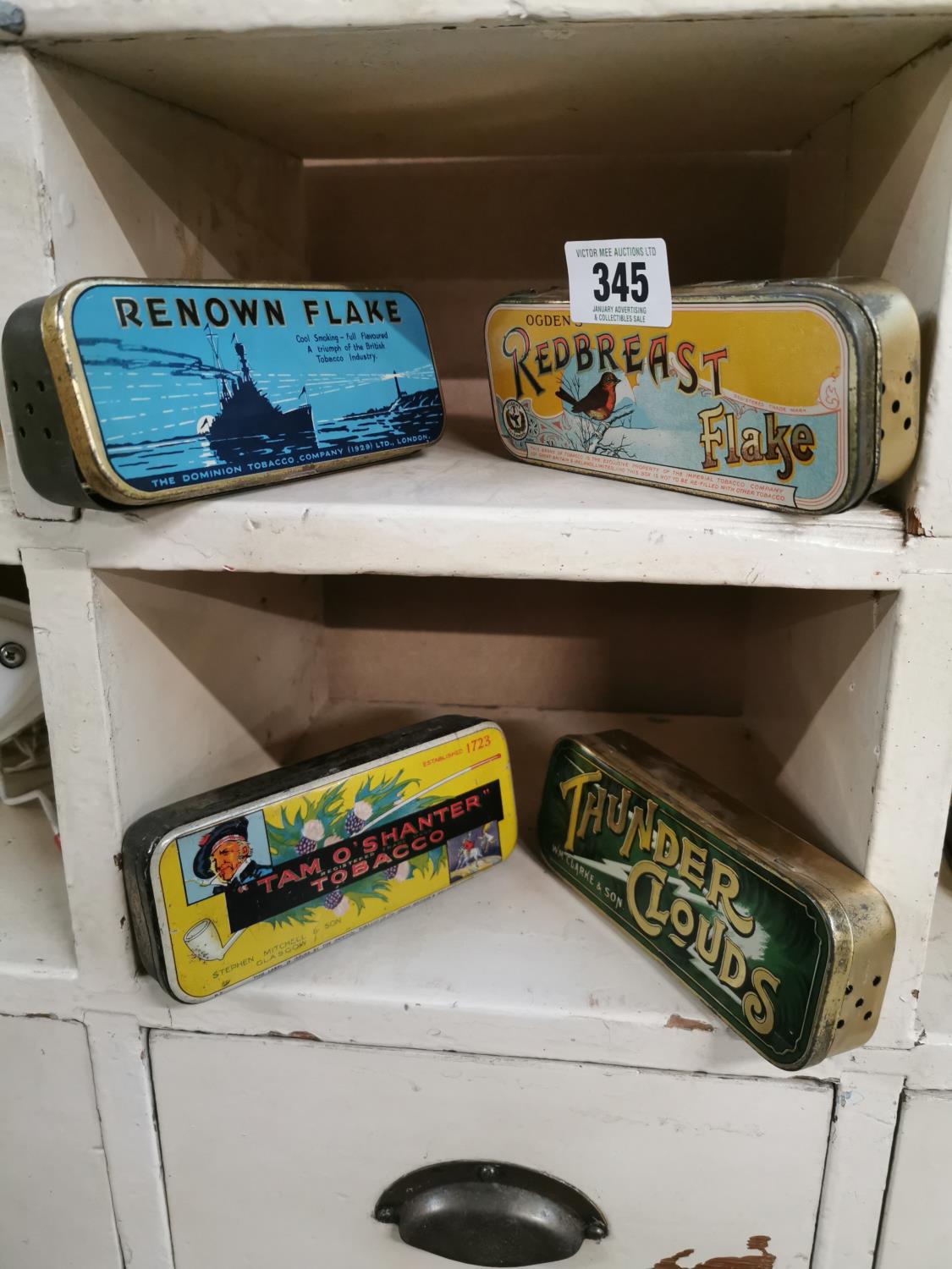 Four tobacco advertising tins.