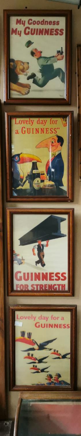 Four Guinness Framed Prints.