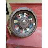 Wooden roulette wheel.