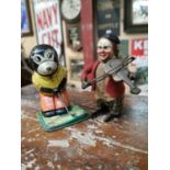 Two vintage tin plate wind up toys.