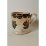 19th. C. spongeware mug decorated with flowers.