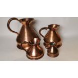 Early 19th. C. set of graduated copper haystack measures.