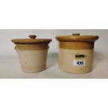 Two 19th. C. stoneware storage jars with original lids.