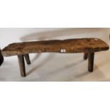 19th. C. pine bench on four tapered legs.