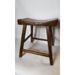 19th. C. elm stool with shaped seat on four splayed legs.