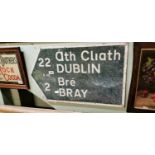 Dublin - Bray bi - lingual finger post road sign .