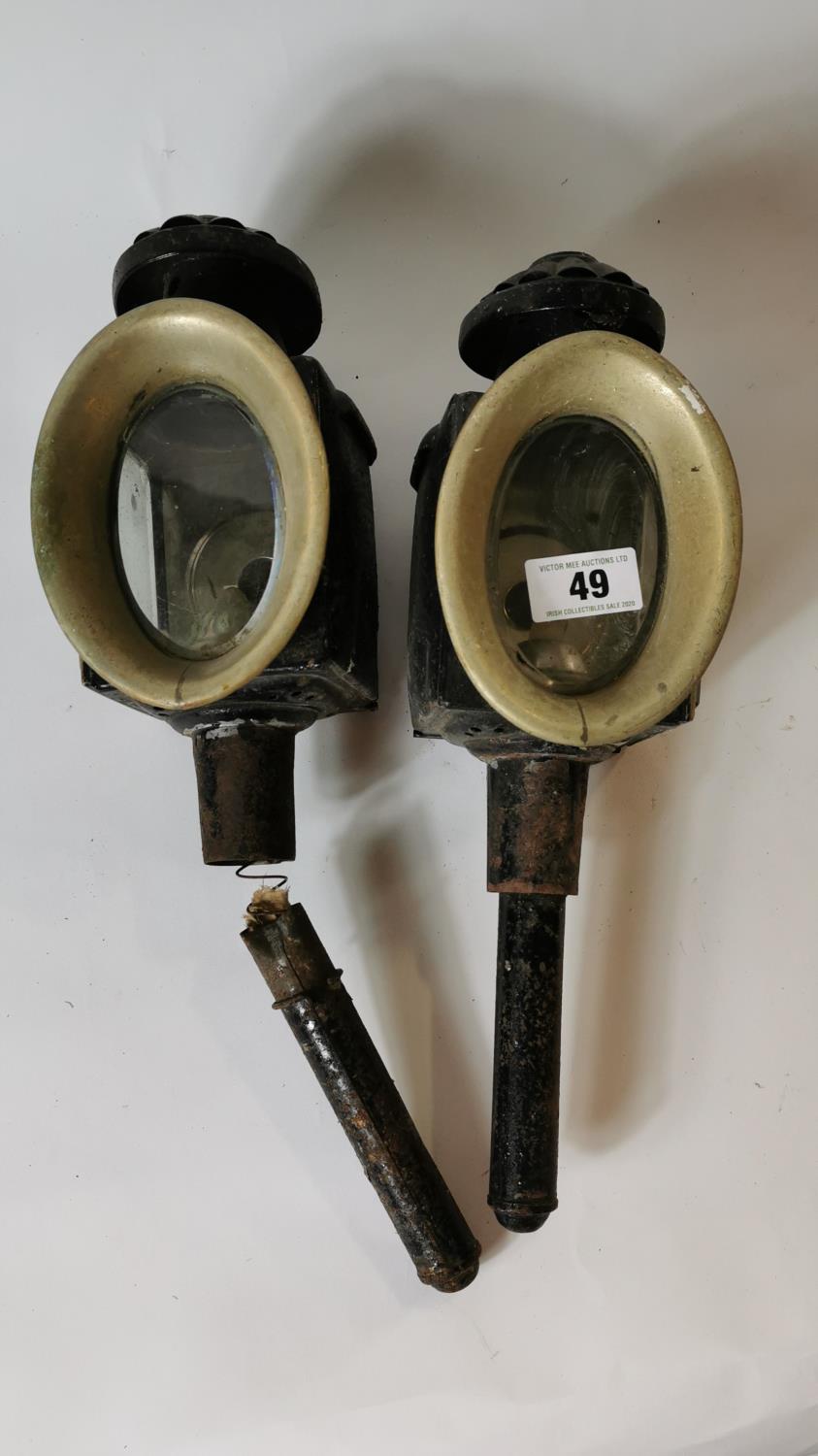 Pair of 19th. C. trap lamps with brass middle.