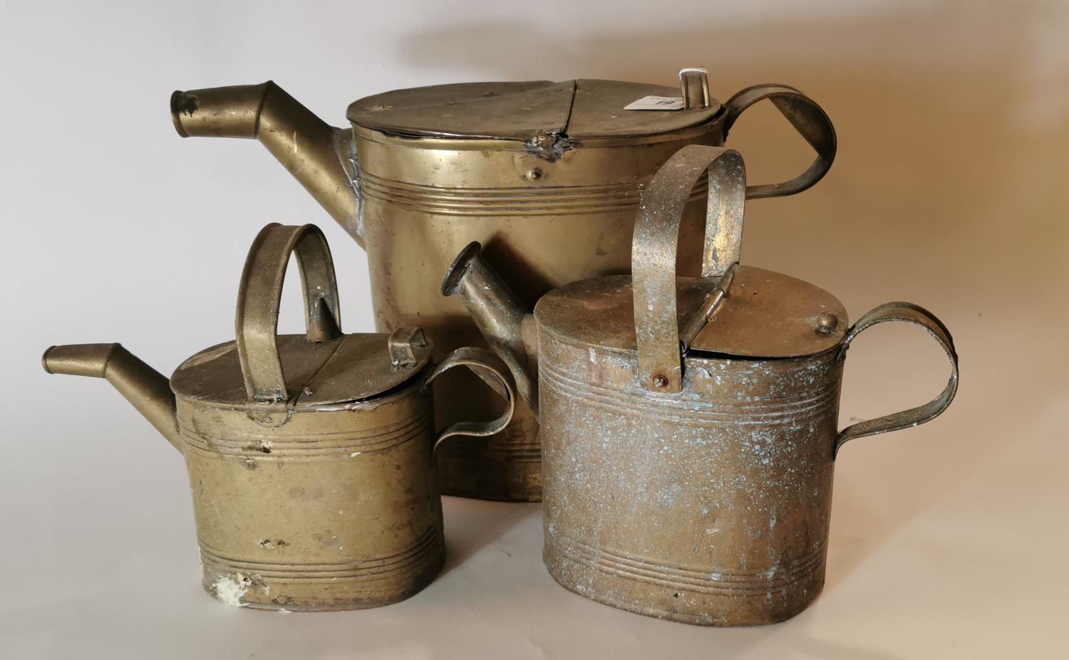 Three 19th. C. graduated brass watering cans.