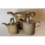 Three 19th. C. graduated brass watering cans.