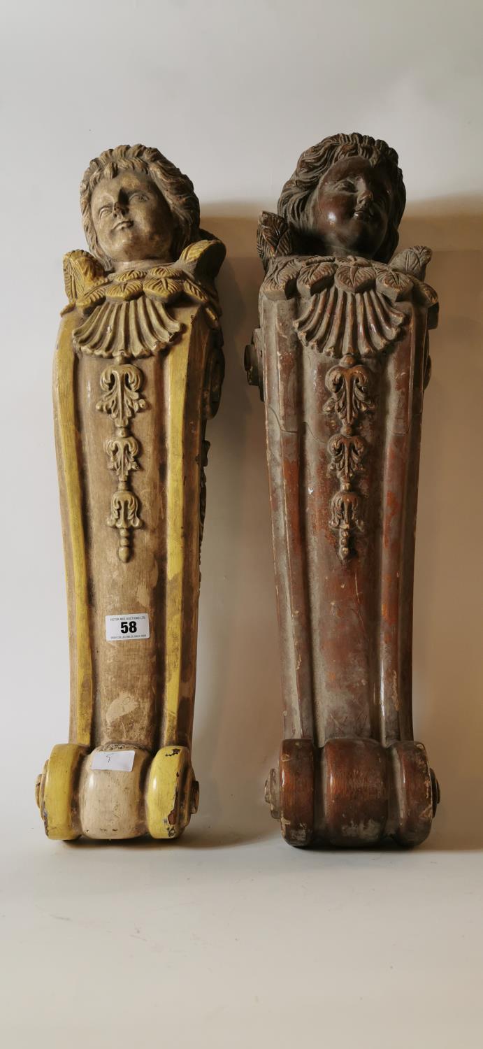 Pair of painted wooden corbels. (79 cm H)