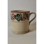 19th. C. spongeware mug decorated with flora and foliage.