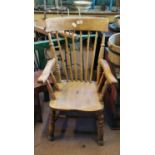 Early 20th. C. beech stick back armchair.