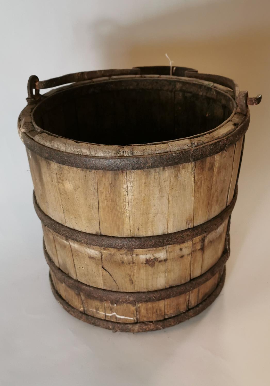 19th. C. bucket with metal hoops. (31 cm H).