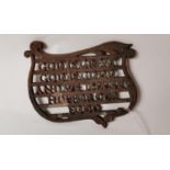 19th. C. cast iron teapot trivet.