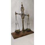 19th. C. brass shop scales on mahogany base.