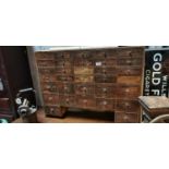 Late 19th. C. thirty six drawer painted pine bank of drawers.