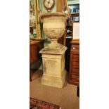 Pair of composition Bagetelle urns on stands