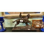 Bronze model of a horse and jockey on a marble base. { 32cm H X 40cm W X 14cm D .