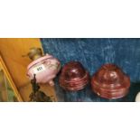 19th. C. pink glass lamp bowl and two ruby lamp bowls.