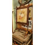 19th. C. rosewood fire screen with inset tapestry panel.