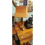 Brass and mahogany table lamp.