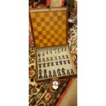 Cased leather chess set.